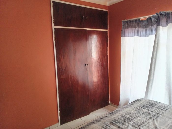 3-Bedroom House For Sale in Roodepoort North with spacious yard and garage.