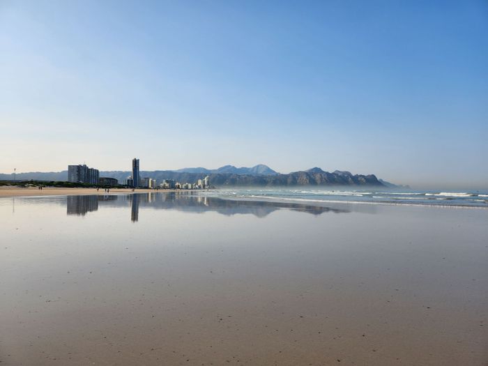 For Sale: Strand North Townhouse with garage, courtyard, and close beach access.