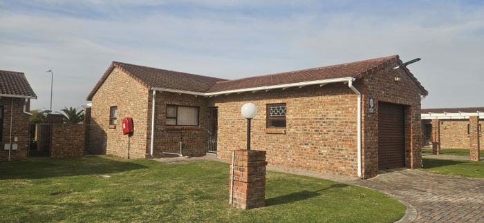 For Sale: Kabega Townhouse with 3 Bedrooms, Garage, Garden, and Security Features.