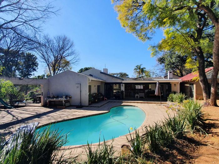 Spacious Bryanston East house with pool, cottage, and solar panels for sale.