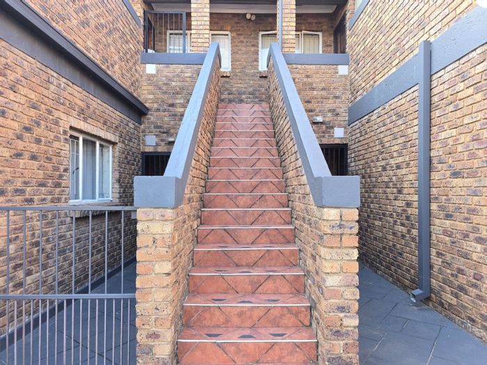 For Sale: Apartment in Hennopspark with balcony, braai, and secure parking.