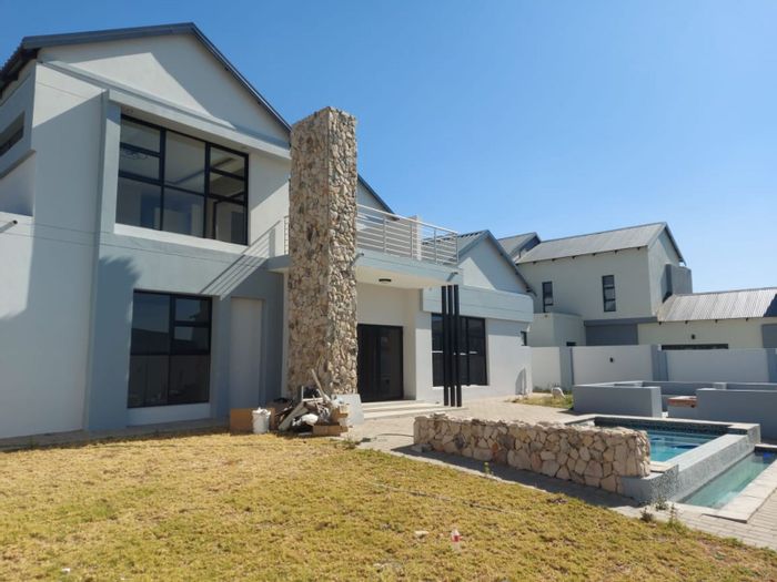 For Sale: House in Six Fountains Estate with pool, garden, and solar panels.