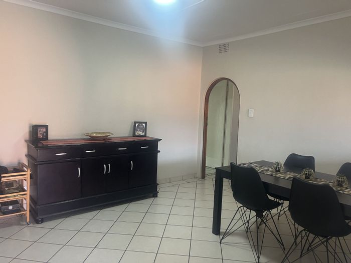 Versatile Benoni AH house for sale with multiple dwellings, stables, and security features.