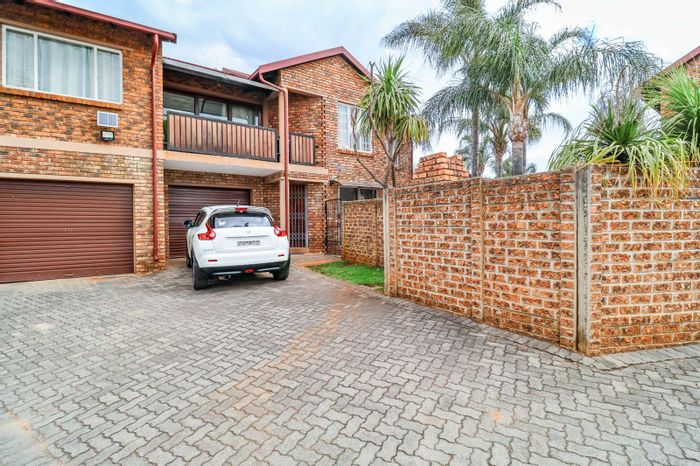 2-Bedroom townhouse in Highveld for sale, features private garden and garage.