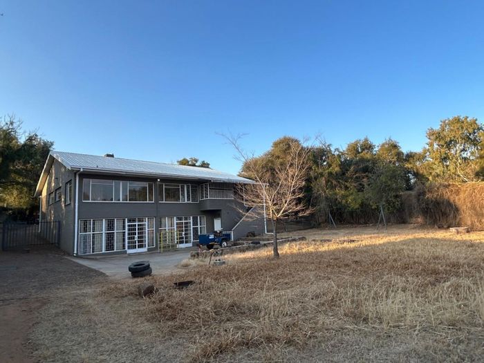 For Sale: Spacious 4-bedroom house with riverfront, guest apartment, and horse stall.