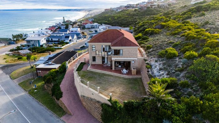 Coastal house for sale in Dana Bay with sea views, balconies, and entertainment area.