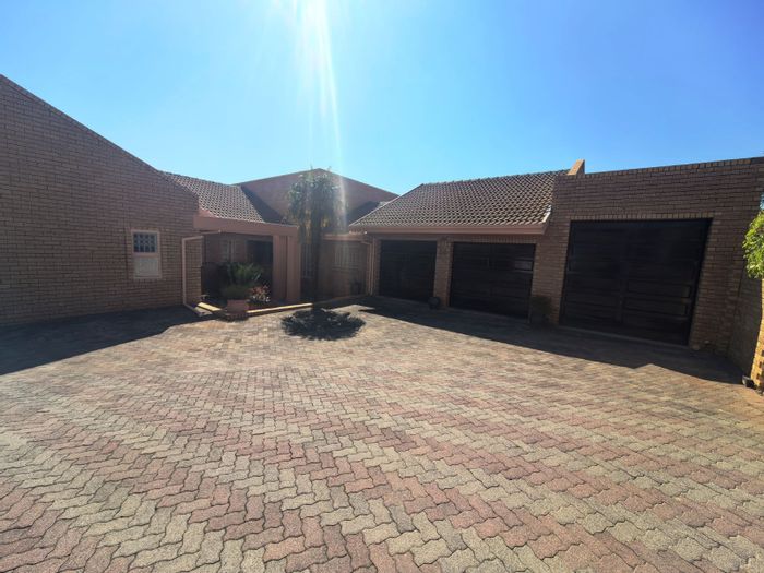 For Sale: Spacious Zwartkop townhouse with 3 beds, garden, and 3 garages.