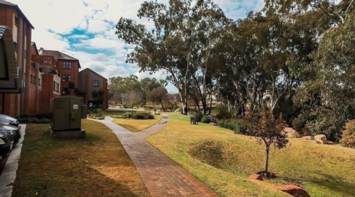 1-Bedroom Apartment in Douglasdale For Sale with Pool, Amenities, and Care Options.