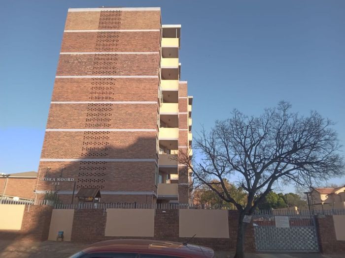 For Sale: 2-Bedroom Apartment in Pretoria North with parking and open-plan layout.