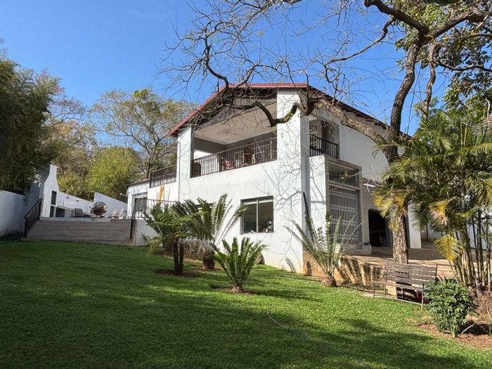 For Sale: House in Hazyview Central with pool, spacious yard, and air-conditioning.