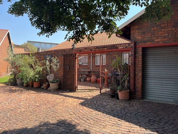 For Sale: 3-bedroom townhouse in Hazeldene with garage and communal garden access.