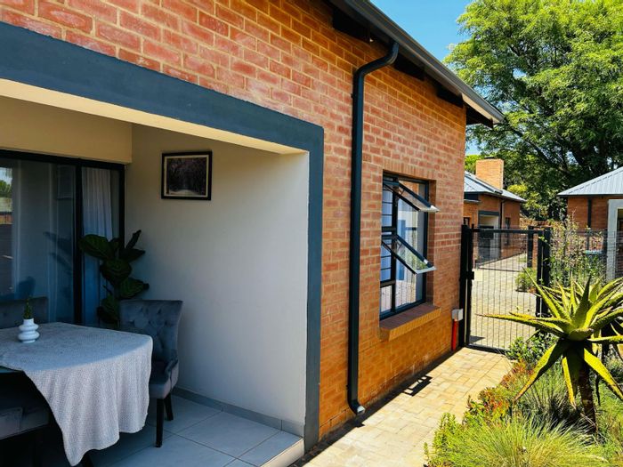 For Sale: 2-bedroom townhouse in Annlin with garden, braai area, and double garage.