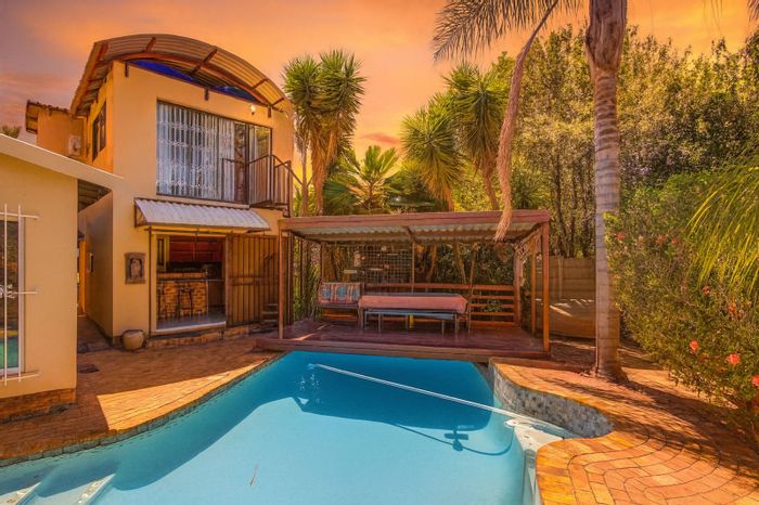 For Sale: Spacious 8-bedroom house in Van Riebeeck Park with pool and ample parking.