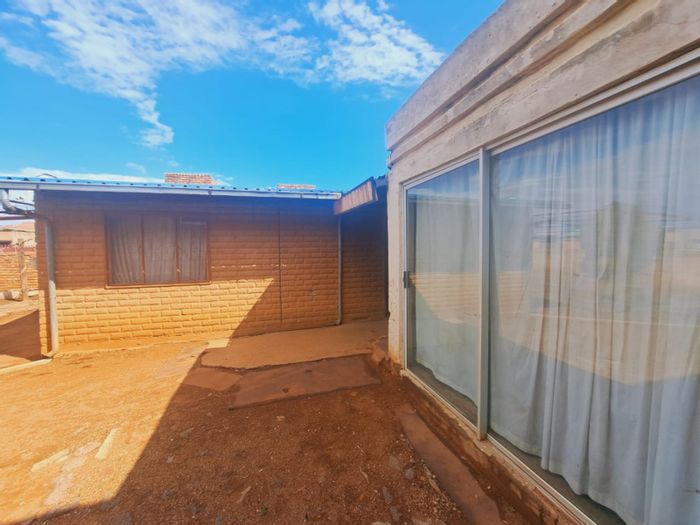 House for Sale in Mamelodi East: 2 beds, 4 outside rooms, development potential.