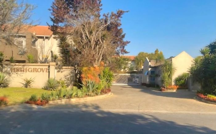 For Sale: 2-Bedroom Apartment in Magaliessig with Garden, Pool, and Carport.