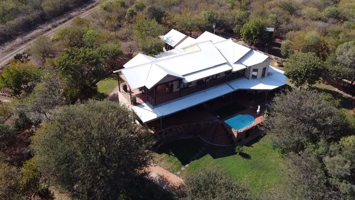 Thabazimbi Rural Farm For Sale: Income-generating properties, game boma, and solar power.