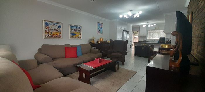 For Sale: Noordheuwel Townhouse with private garden, garage, and wheelchair access.