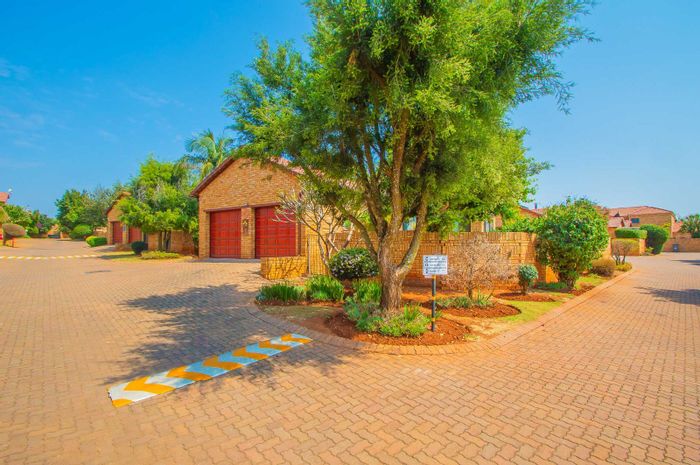 For Sale: 3-Bedroom Townhouse in Ruimsig with garden, braai area, and double garage.