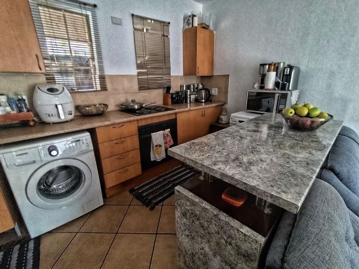 For Sale: Apartment in Laser Park with 2 bedrooms, parking, and open-plan living.