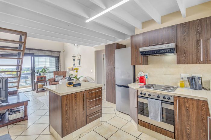 For Sale: 2-Bedroom Apartment in Douglasdale with Loft, Balconies, and Pool Access.