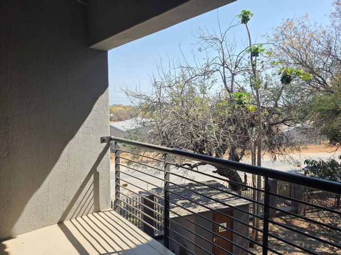 2-Bedroom Apartment with Pool, Veranda, and Secure Parking in Hoedspruit Central For Sale.