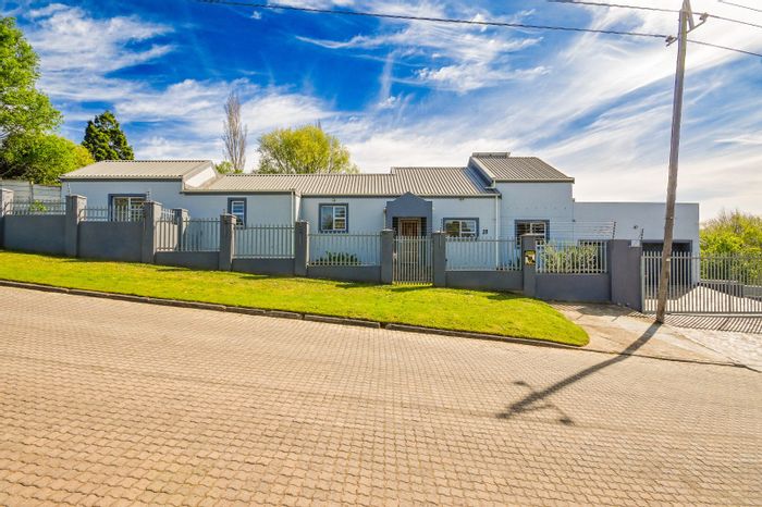 For Sale: House in Grabouw Central with 4 bedrooms, inverter system, and borehole.