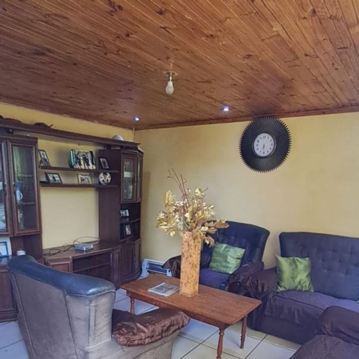 Hillcrest House For Sale: 3 Bedrooms, spacious layout, covered parking, potential for upgrades.