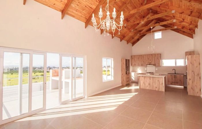 For Sale: House in Saldanha Heights with ocean views, open-plan living, and security.