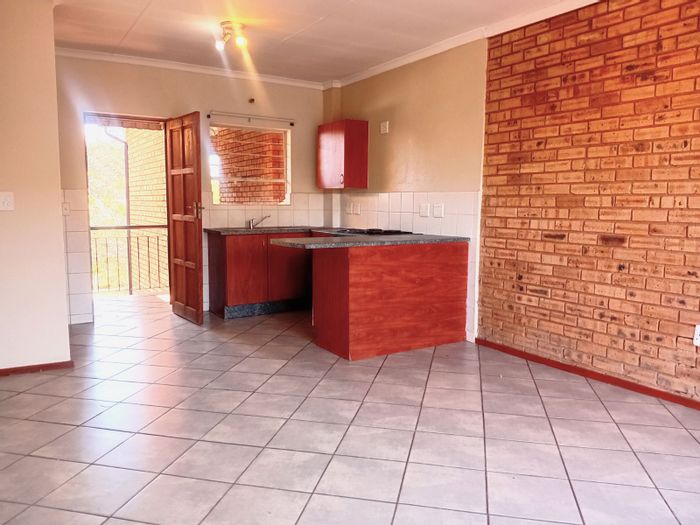 2-Bedroom Apartment For Sale in Honeypark with open-plan living and parking options.