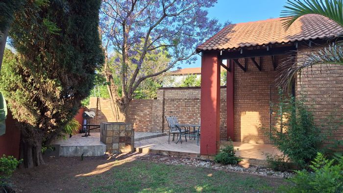 For Sale: Townhouse in Moreleta Park with garden, double garage, and built-in braai.