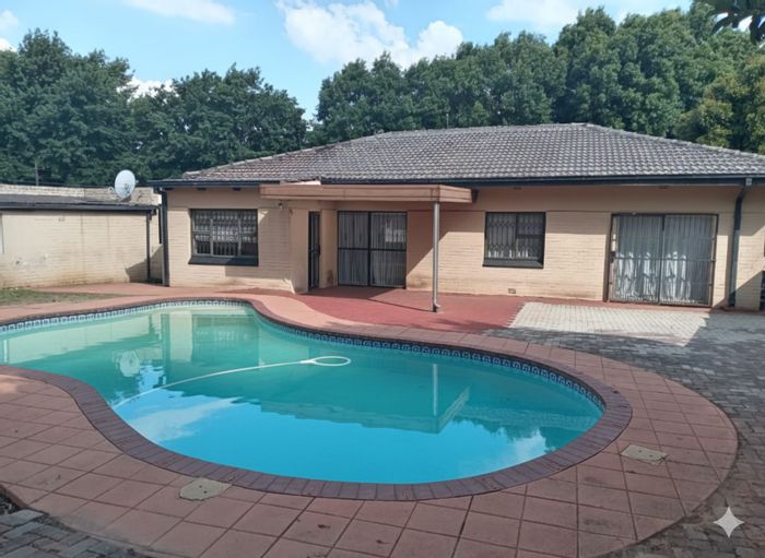 For Sale: Florida House with Pool, Cottage, Security, and Spacious Living Areas.