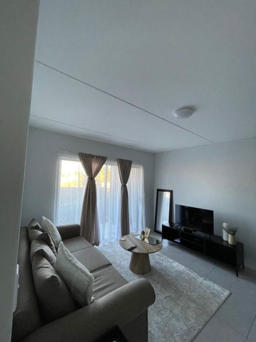 For Sale: 2-Bedroom Apartment in Kosmosdal with pool, security, and garden.