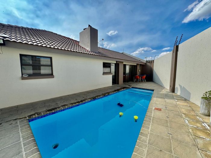 For Sale: Spacious 4-Bedroom House in Secunda Central with Pool and Inverter System.