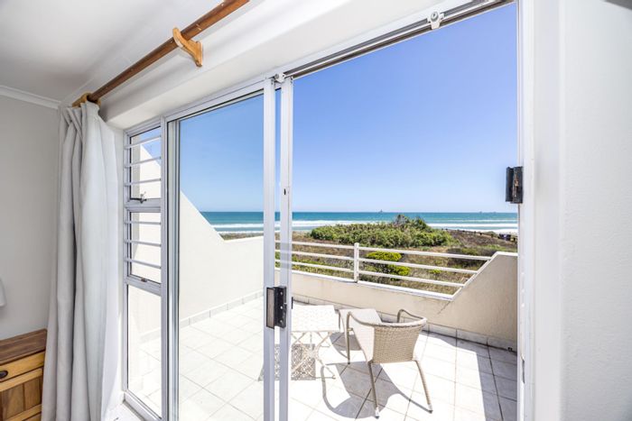 Beachfront House For Sale in Woodbridge Island with direct beach access and views.