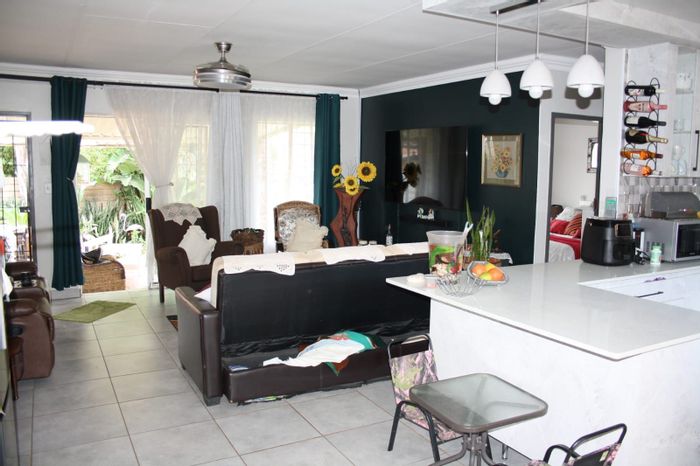 For Sale: Townhouse in Doornpoort with 3 beds, garden, and double garage.