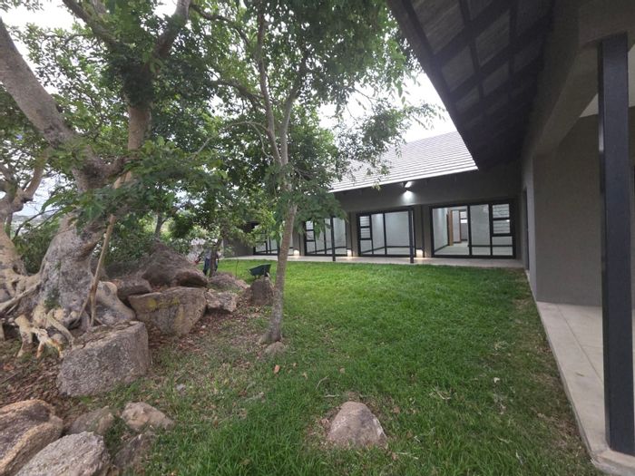 For Sale: House at The Edge with 4 bedrooms, expansive patios, and double garage.