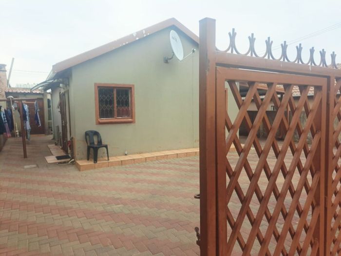 House for Sale in Mamelodi East: 2-bed home, tenanted rooms, secure parking.