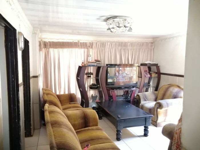 For Sale: House in Mamelodi East with dual homes, garage, and carports.