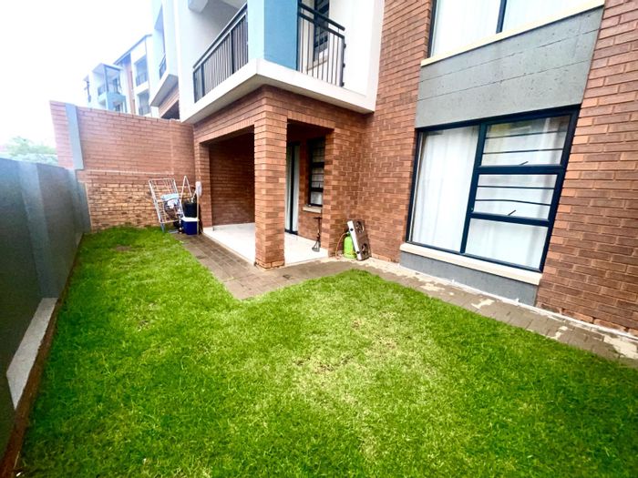 Ground-floor 2-bedroom apartment for sale in Amberfield with private garden and security.