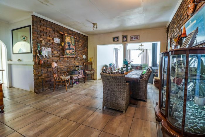 Spacious Rooihuiskraal house for sale with pool, lapa, and ample parking.