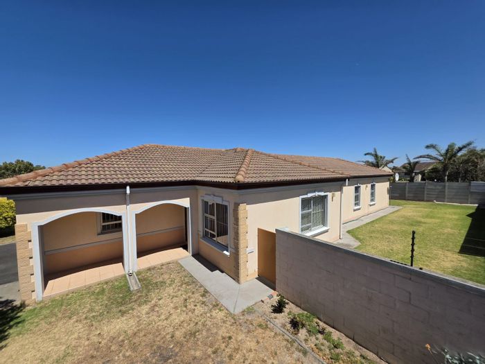 Spacious 4-bedroom house in Strand South with garden, garage, and inverter. For Sale.