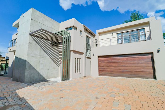 For Sale: House in Carlswald with 4 bedrooms, ensuite, garden, and double garage.