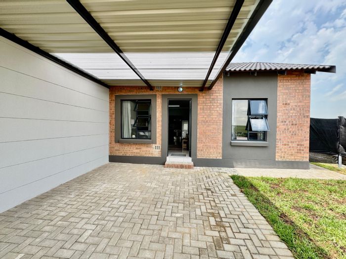 For Sale: 2-Bedroom Townhouse in Trichardt, secure complex, open-plan living.