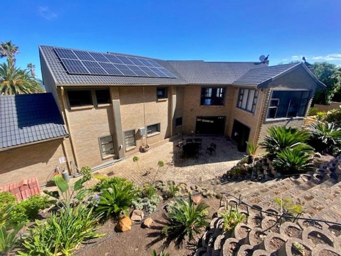 For Sale: Spacious 7-bedroom house in Outeniqua Strand with sea views and braai room.