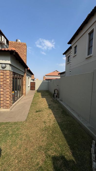 For Sale: Terra Nova Townhouse with garage, open-plan living, and private garden.