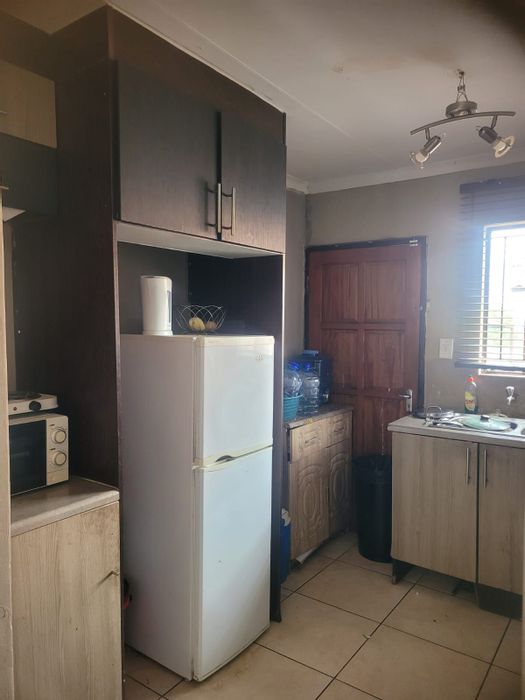 For Sale: 2-Bedroom House in Tasbet Park with open-plan living and secure yard.