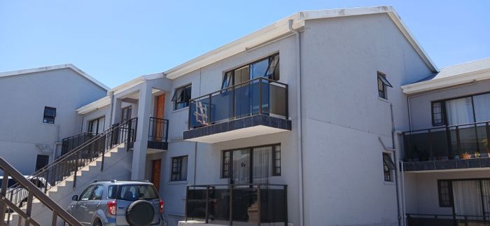 2-Bedroom apartment in Hartenbos Central for sale with balcony and braai area.