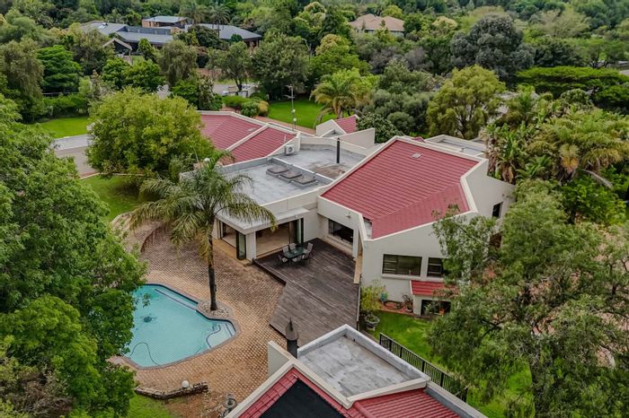 For Sale: Unique Ruimsig house with dual dwellings, tennis court, and botanical views.