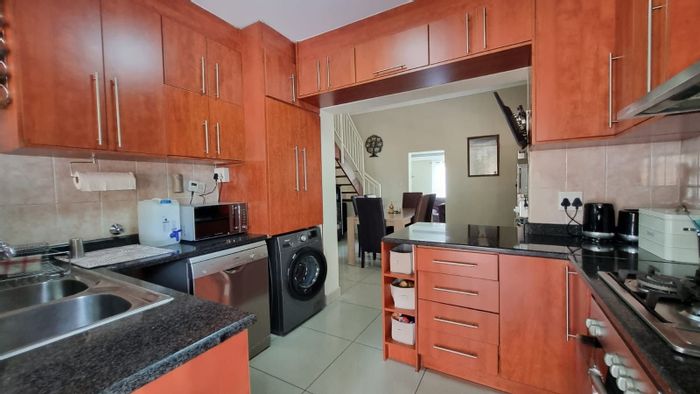 For Sale: Noordwyk House with 3 beds, garden, garage, and investment potential.