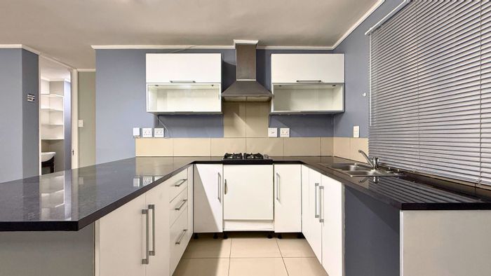 Gansbaai Central Apartment For Sale: 2 Bedrooms, enclosed balcony, secure parking, lift access.